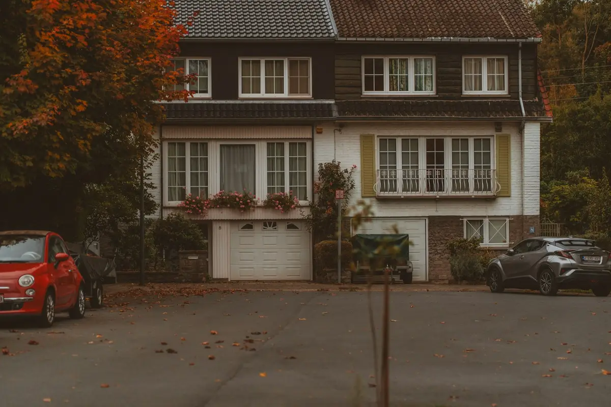 Pair of semi-detached houses with garages, seen from the front