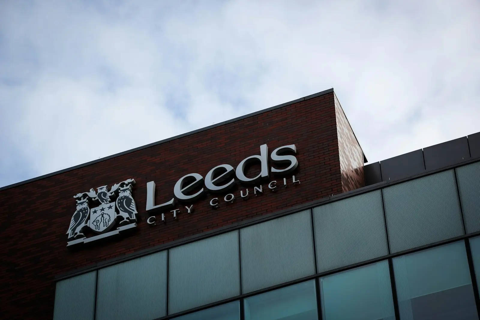 Leeds City Council crest and lettering on a council building